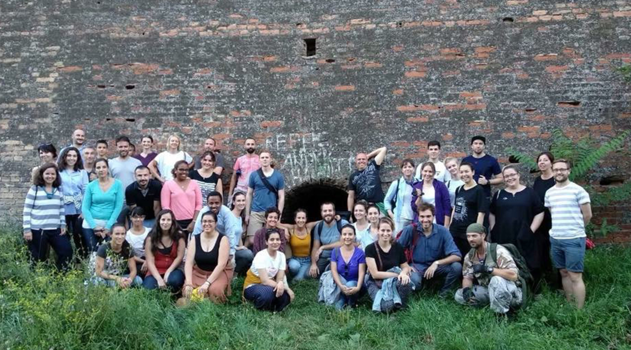 Group in front of wall