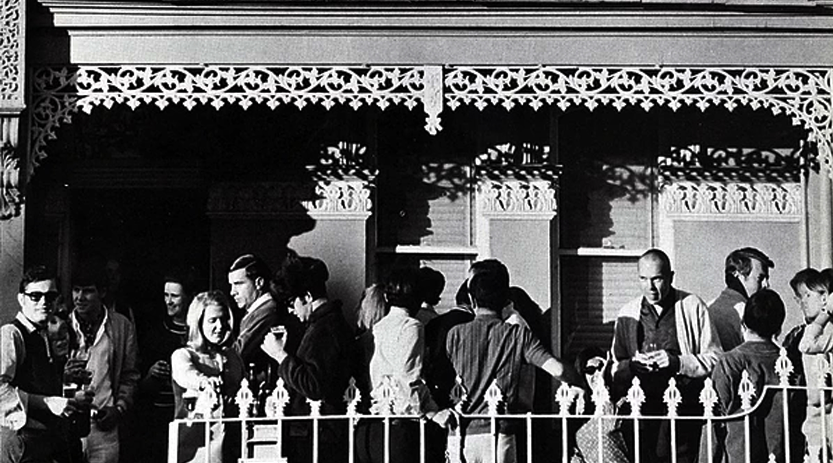 People gathered on a terrace balcony