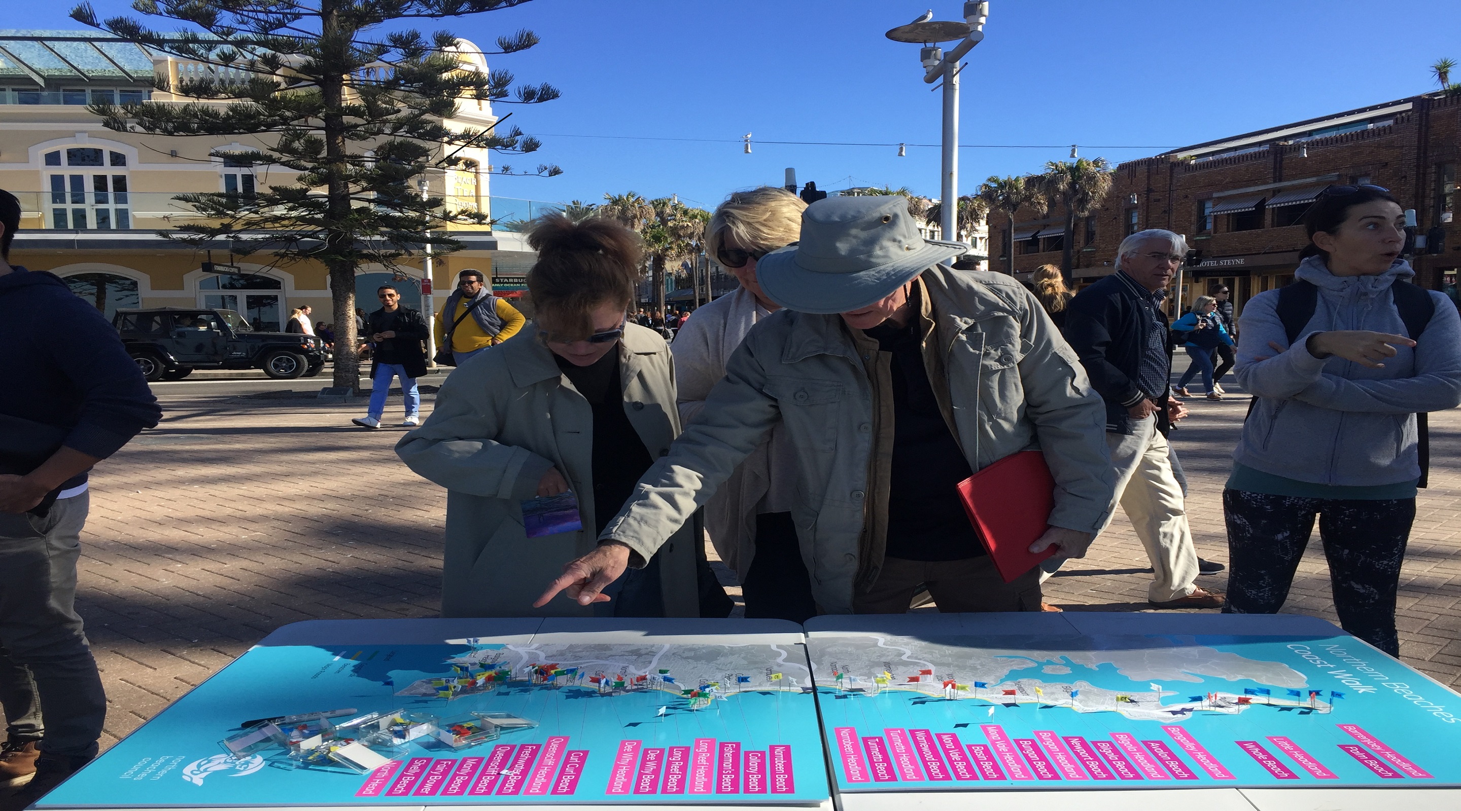 People pointing to a map